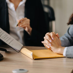 Do I need a defense attorney if I am innocent , Judge gavel with scales of justice, Asian business and lawyer or counselor consulting and discussing contract papers with laptop and tablet at law firm in office.