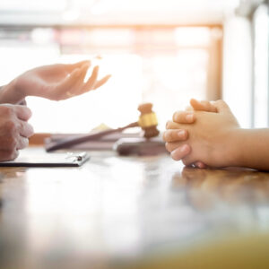 Client talking with criminal lawyer with regards to Financial Compensation for Victims of “Revenge Porn”